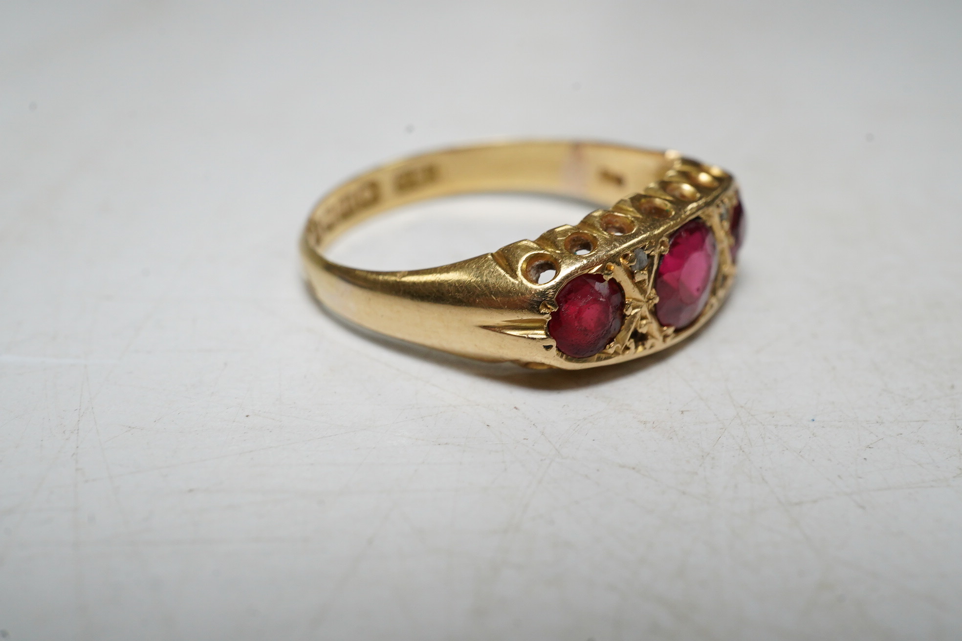 An 18ct gold, red doublet and diamond chip set dress ring, size N, gross 3 grams. Condition - poor.